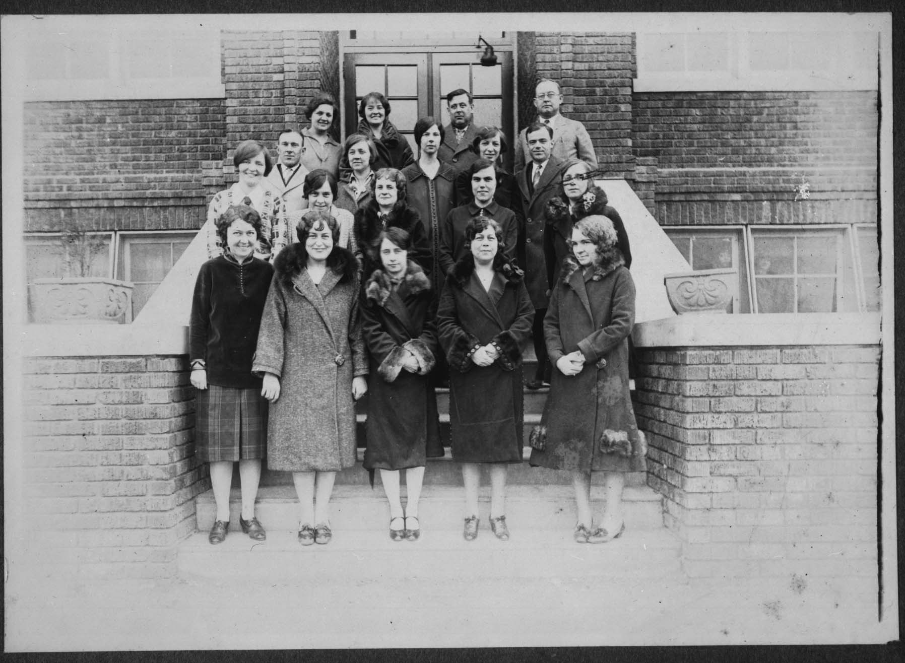 The teachers at Tech High stand in front of the school for this 1926 photograph. First Row: Mabel Underwood, Mary Sossoman, Lottie Ona Barkley, Aubin Wert, Thelma Ashworth. Second Row: Helen McManus, Carolyn May, Ruth Brawley, Ruth Kohn, Helen Dodds. Third Row: O.P. Littell, Nattye McNinch, Lula Faye Clegg, Daphne Ransom, S. L. Gunderson. Fourth Row: Stella Kittles, Maie Myers, N.F. Collage and Forest T. Selby.