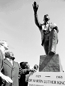 King’s father standing beside the statue with Governor Jim Hunt.