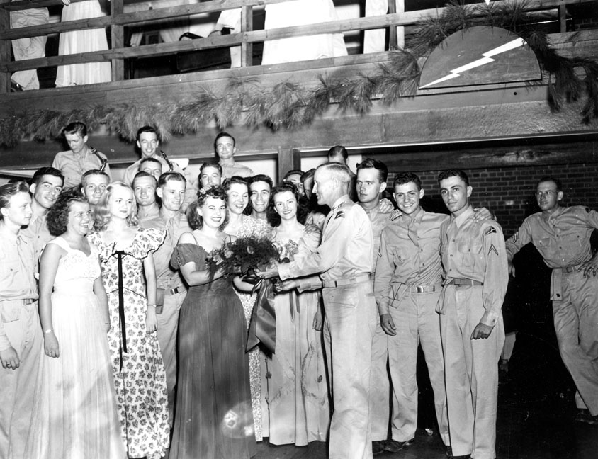 "Presentation of flowers to beauty queen at Service Club #2, Camp Butner, N.C."