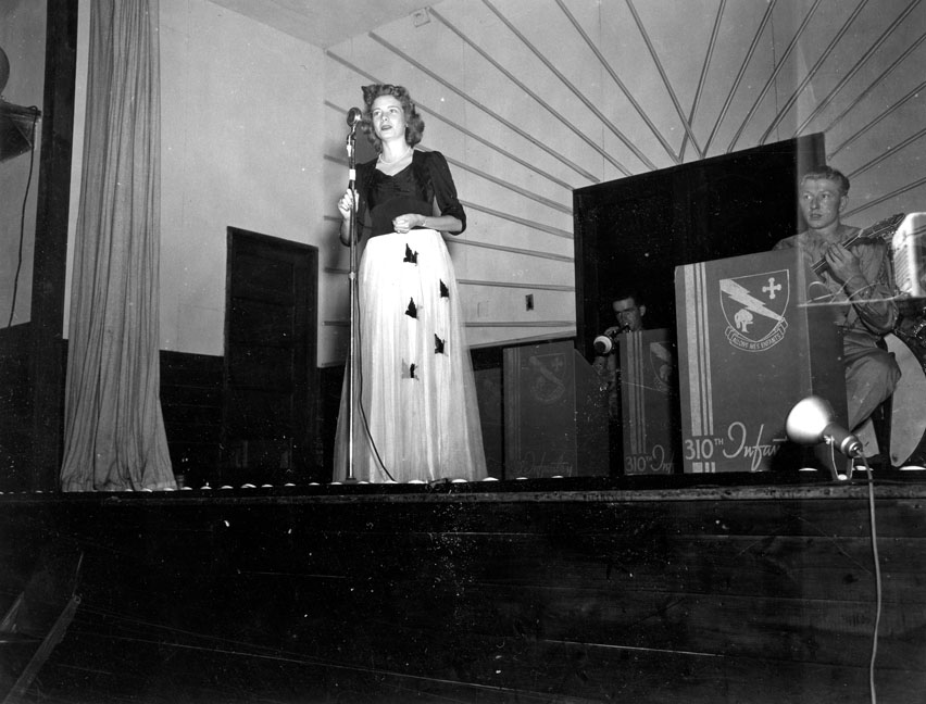 "Singer at Variety Show, 310th Infantry -78th Div, Camp Butner, N.C."