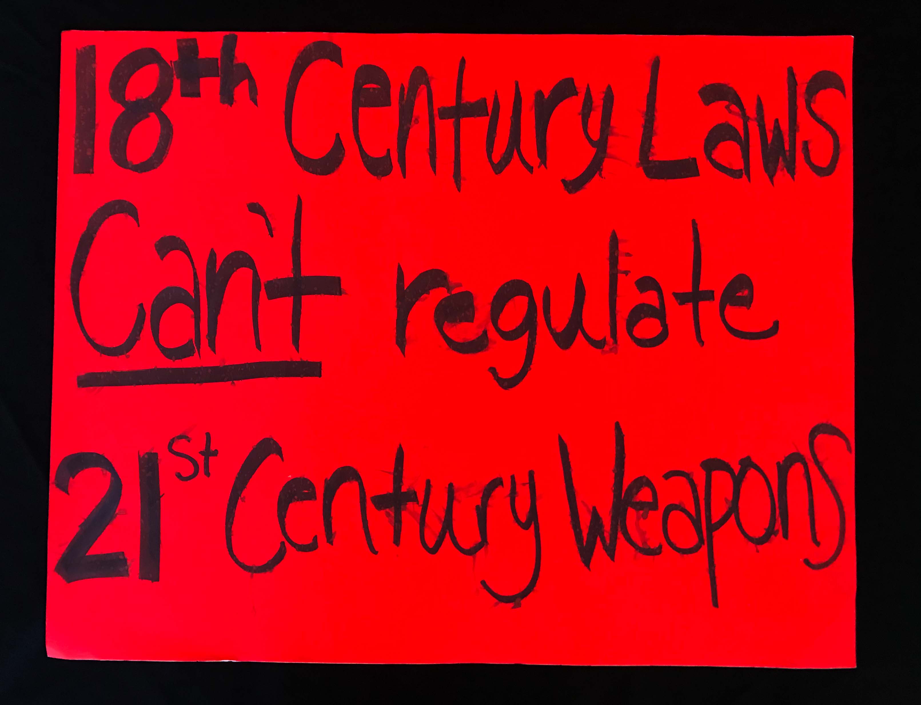 Charlotte March for Our Lives, 2018. Sign reads: "18th-century laws can't regulate 21st-century weapons."