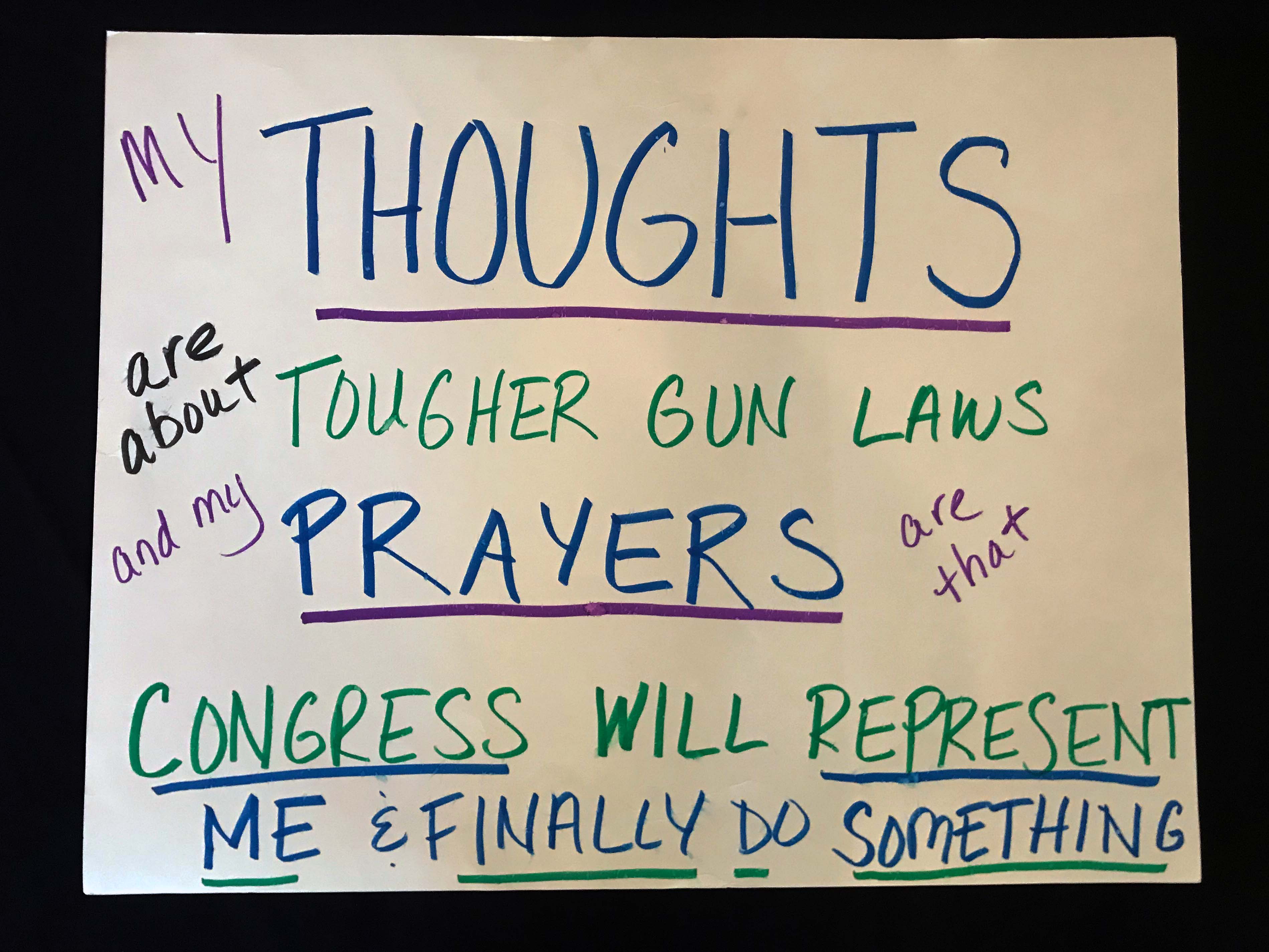 Charlotte March for Our Lives, 2018. Sign reads: "My thoughts are about tougher gun laws, and my prayers are that Congress will represent me and finally do something."