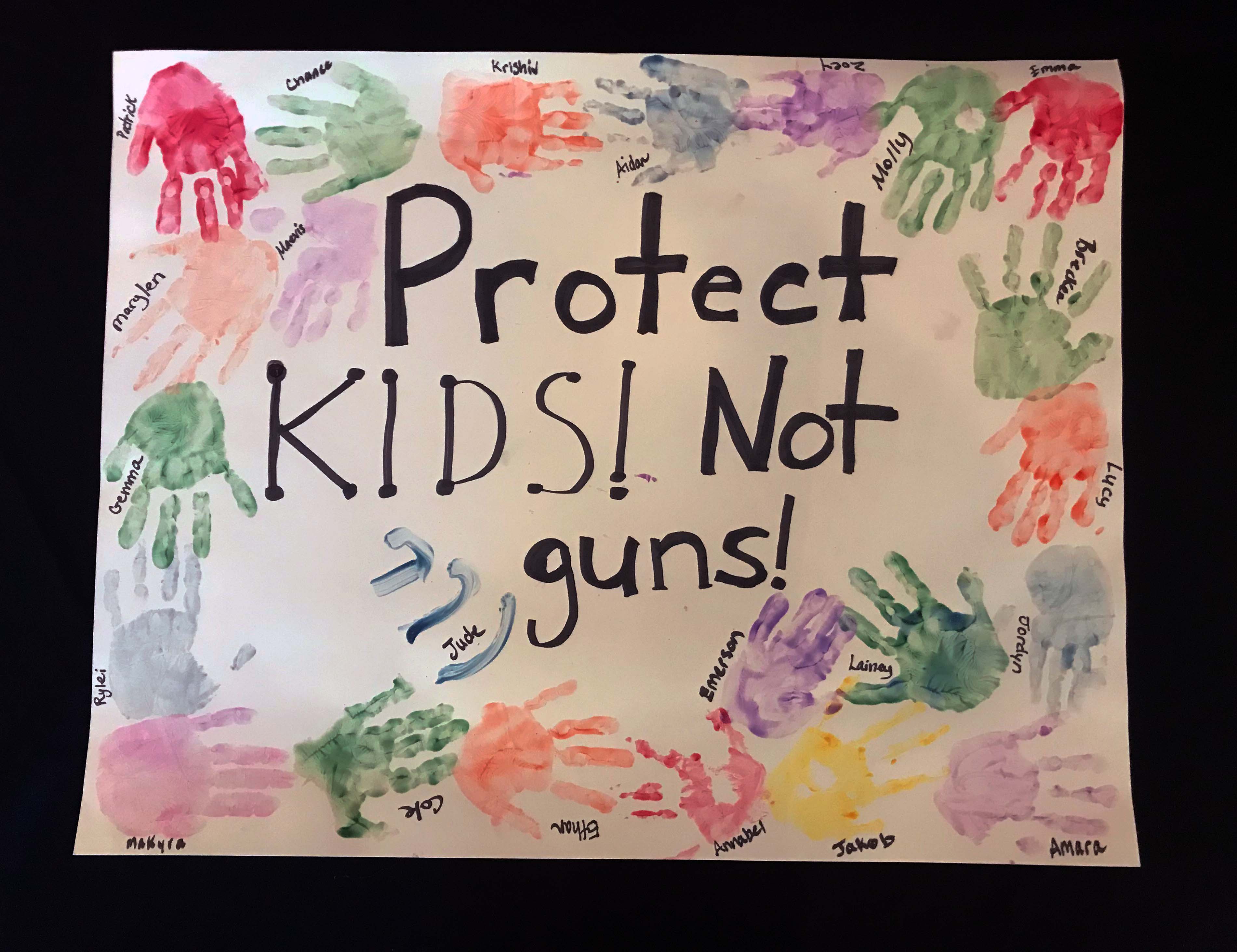 Charlotte March for Our Lives, 2018. Sign reads: "Protect kids! Not guns!"