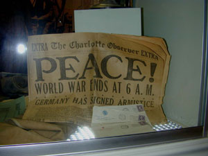 Closer view of newspaper in exhibit case Closer view of newspaper in exhibit case