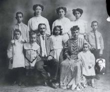 The Tate Family, c. 1910. Left to right, front row: Aurelia (Midge), William, Thaddeus L. Tate, Sr., Mildred, Mary Butler Tate, Talmadge, Edwin. Second Row: Thaddeus Jr., Maggie, Estelle, Cora. Inset: Guion. LAURA M. BOOTON.