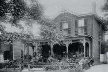 The Tate family lived in this elegant home at 504 East 7th Street. Thaddeus Tate opened a barber shop in 1882 which prospered for over sixty years. He co-founded several of Charlotte's leading black businesses, including the Afro-American Mutual Insurance Company and the Mecklenburg Investment Company. LAURA M. BOOTON.