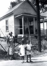 Bertha Pinckenpack in front of her house on Alexander Street with her great-granddaughters, Geraldine and Beverly, c. 1950. GERALDINE JOHNSON BLENMAN.