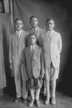 The Alexander Brothers, c. 1928. Left to right: Frederick Douglas, Louis Franklin, Zachariah; front: Kelly Miller. MRS. KELLY M. ALEXANDER, SR.