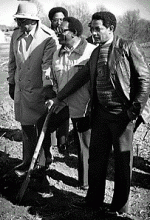 Owner John McDonald, middle, breaks ground