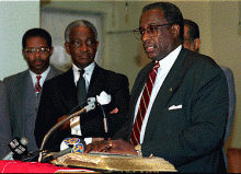 Walton, Rev. Jerry Cannon, and Bob Davis, chairman of Charlotte-Mecklenburg Black Caucus