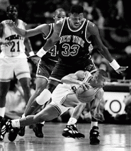 Muggsy Bogues dribbles past Patrick Ewing