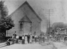 Little Rock AME Zion Church, originally located in Third Ward, in the process of being moved to Myers Street in First Ward in 1911. Because the move took place over several days, it was necessary  to hold a funeral in the sanctuary during the move. FLORETTA DOUGLAS GUNN.