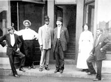Business people of Brooklyn in front of the Queen City Drug Store on East Second Street, c. 1910. CHARLOTTE-MECKLENBURG HISTORIC LANDMARKS COMMISSION.