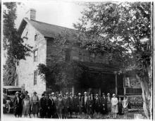 DAR members in front of Hezekiah Alexander rock house