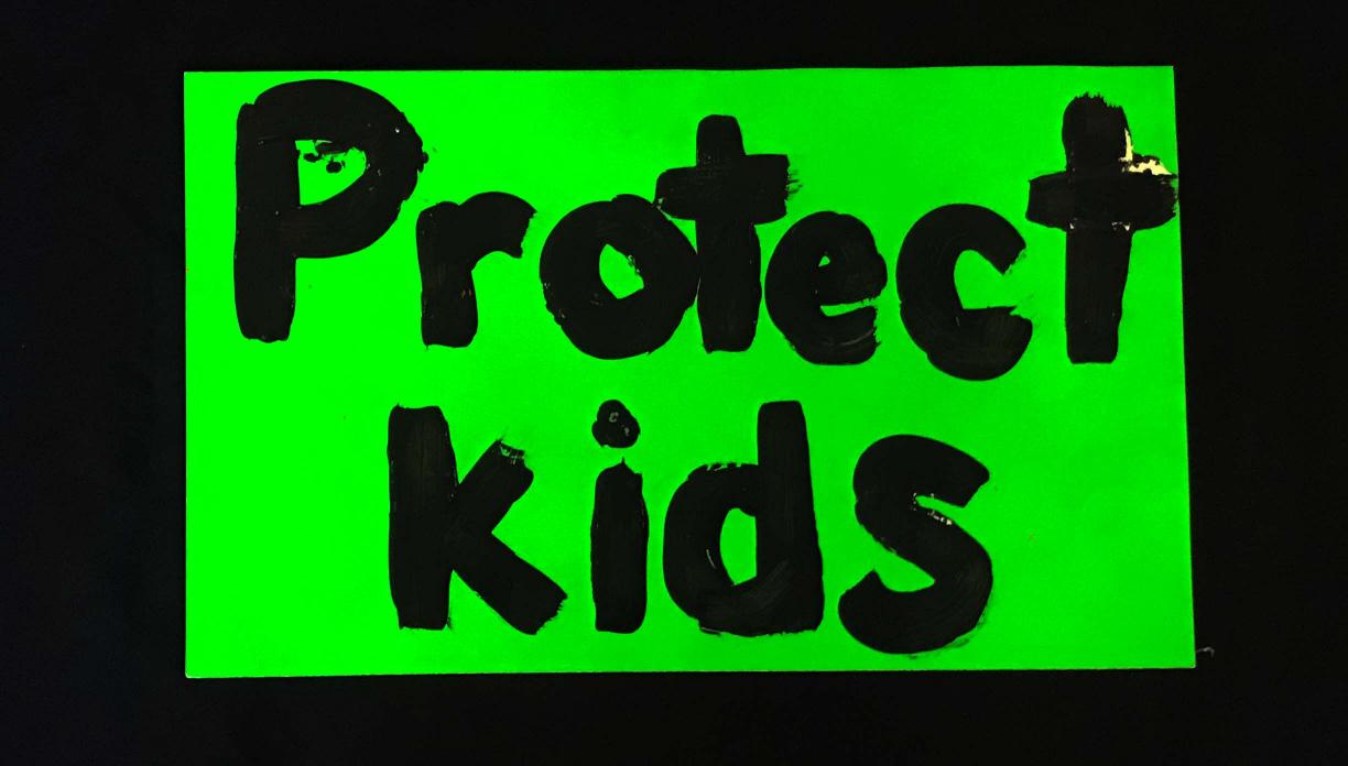 Charlotte March for Our Lives, 2018. Sign reads: "Protect kids"