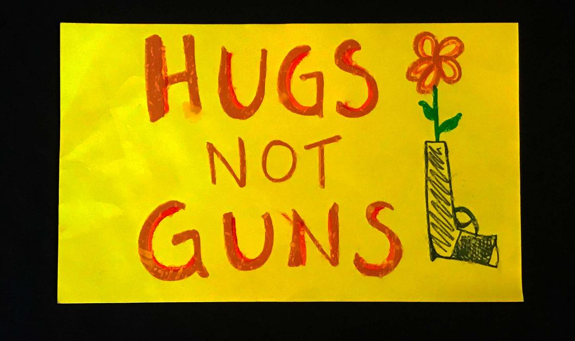 Charlotte March for Our Lives, 2018. Sign reads: "Hugs, not guns"