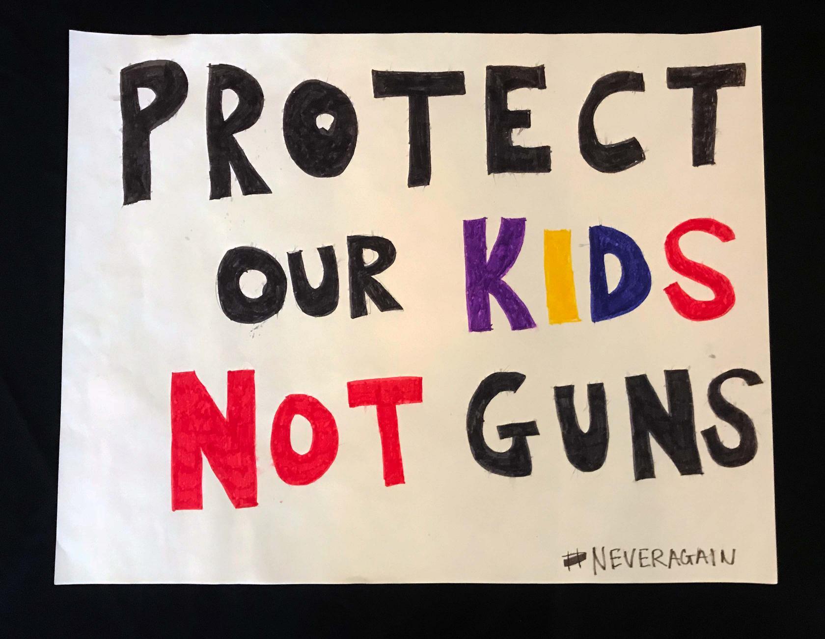 Charlotte March for Our Lives, 2018. Sign reads: "Protect our kids, not guns."